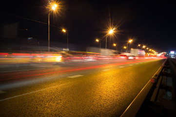 Fototapeta na wymiar Speed motion,abstract background rays.Traffic car lights on road.