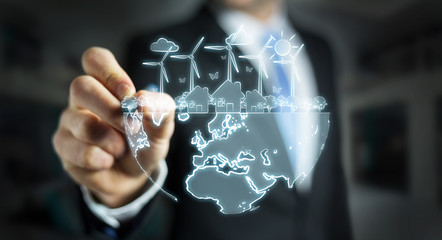 Businessman drawing renewable energy sketch