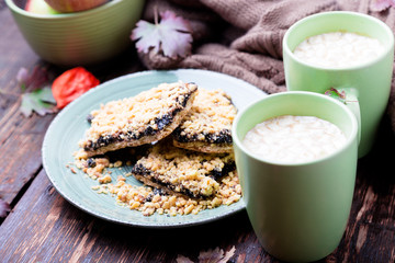 Two cup of coffee or hot chocolate with marshmallow near knitted blanket and pie. Autumn concept. Christmas