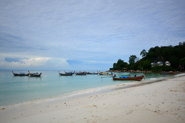 Fototapeta na wymiar Tropical white sand and blue sea with blue sky at Andaman Sea. Lipe Island, Satun, Thailand.