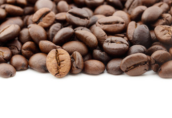 close up of coffee beans isolated on white background