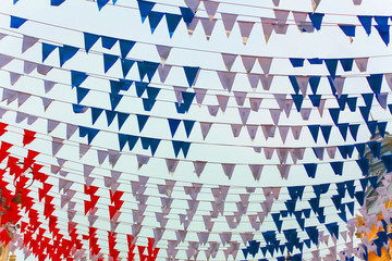 Fototapeta premium colored flags festive on a city street