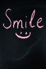 Inscription Smile on a Dark Background.