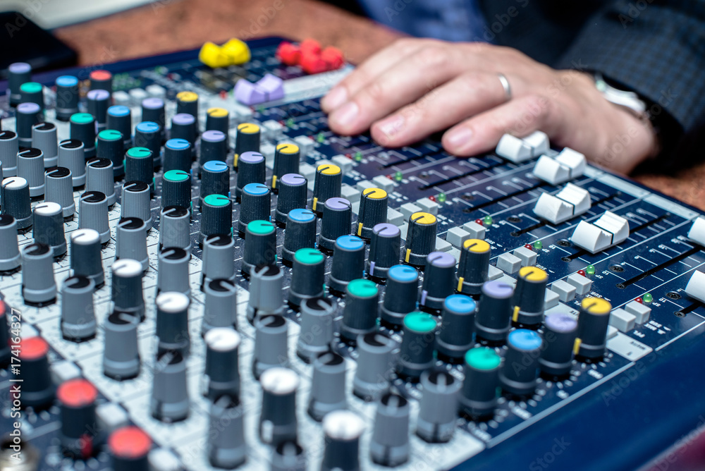 Wall mural Blue DJ audio mixer shot close-up 