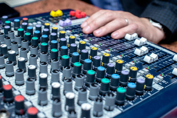 Blue DJ audio mixer shot close-up 