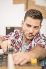 Man working on wood planks for home-improvement