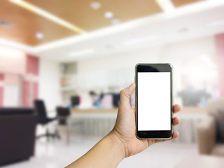 hand holding phone with hospital service background