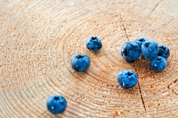 Blueberries scattered on the stump.