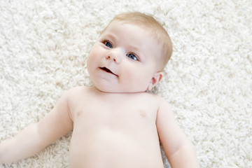 Portrait of cute baby girl looking at the camera