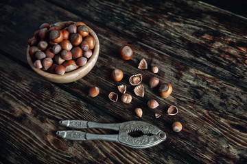 Cup with nuts Hazelnut on a wooden table