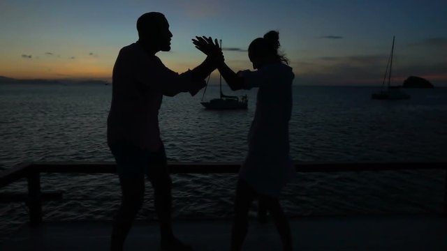 Couple having a fight with each other at night on the boat, slow motion shot at 240fps, steadycam shot
