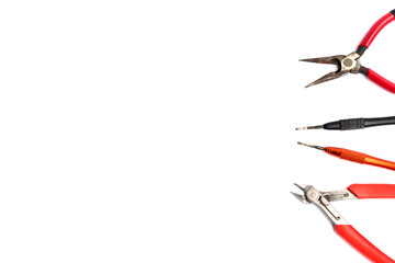 Flat lay of various craftsman tools or hand tools on white background with copy space using as construction tools, workshop and craft concept.