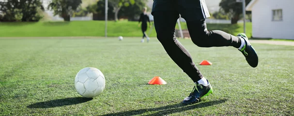 Tuinposter Leg skill training on football field © Jacob Lund