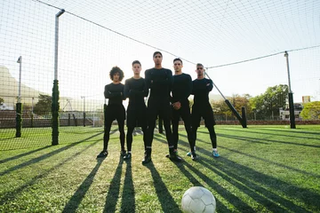Foto op Plexiglas Soccer players standing together on pitch © Jacob Lund