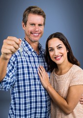 Couple Holding key in front of vignette