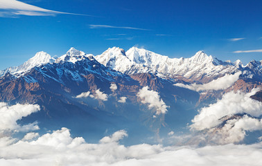 Snowy mountain range Ganesh Himal and Manaslu Himal in clouds - Himalayas, Langtang, Nepal