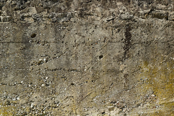 Old grungy beige wall texture, close up
