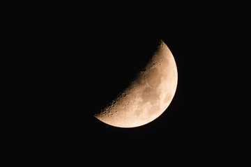 Half Moon on a dark night sky.