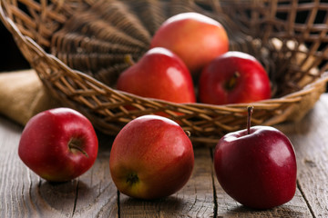 Fresh apples in wicker basket