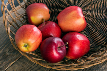 Fresh apples in wicker basket