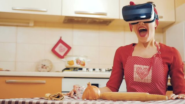 Pin-up girl in virtual reality glasses scared and drops things off the table