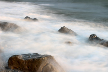sea shore, surf, rocks on the shore of the ocean