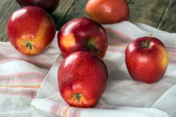 Fresh apples on wooden surface