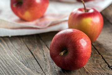Fresh apples on wooden surface
