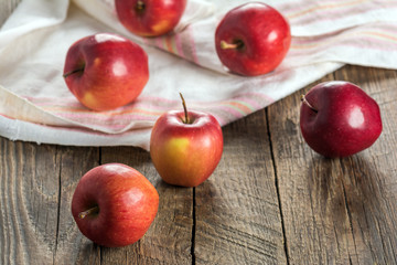 Fresh apples on wooden surface