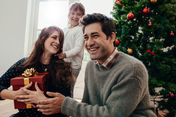 Obraz na płótnie Canvas Family celebrating Christmas at home.