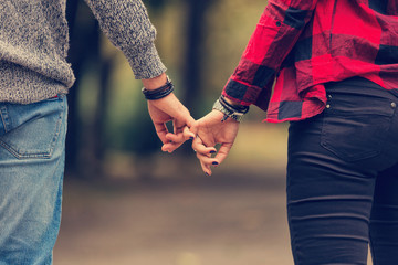 Couple in love holding hands.