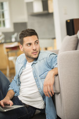 Upper view of young man using laptop computer at home