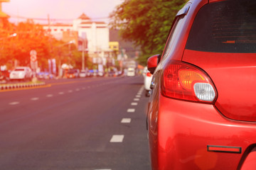  red  car parking lot on daytime