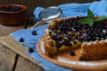 Homemade blueberries pie with custard on shortbread dough. Berries cake.