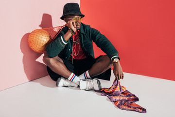 stylish african american man with ball