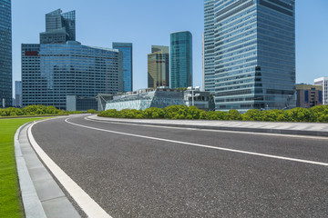 Fototapeta na wymiar urban traffic road with cityscape in background in Shanghai,China..