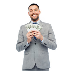 smiling businessman with american dollar money