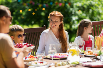 happy family having dinner or summer garden party