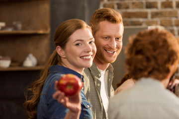 woman showing apple