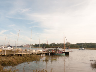 Fototapeta na wymiar dock harbour boats moored in river marina stream landscape
