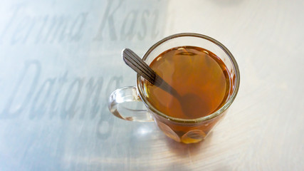 cup of hot tea at restaurant.top view