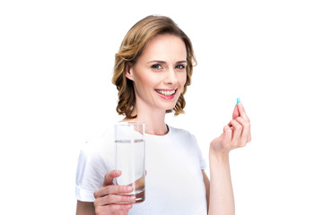 woman with water and pill