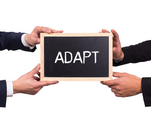 Two men holding mini blackboard with ADAPT message