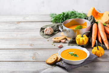 Fall autumn roasted orange pumpkin carrot soup with garlic