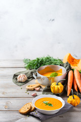 Fall autumn roasted orange pumpkin carrot soup with garlic