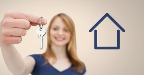 Woman Holding key with house icon in front of vignette