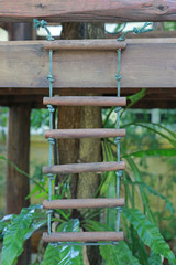 Rope wooden ladder.