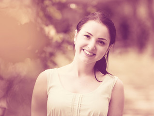 portrait of young female in  dress  near roses in a outdoors