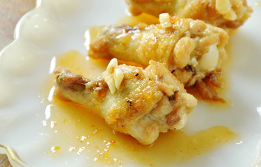 fried chicken drumsticks with salt and pepper dressing sweet chili sauce on plate