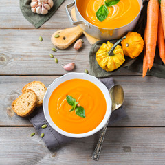Fall autumn roasted orange pumpkin carrot soup with garlic